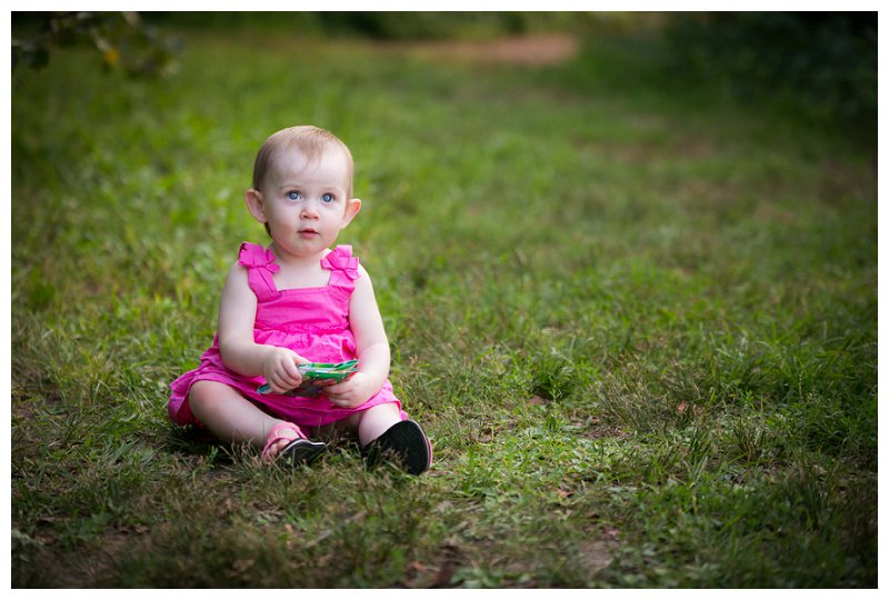 baby sitting in grass