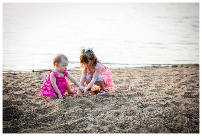 sisters playing in sand