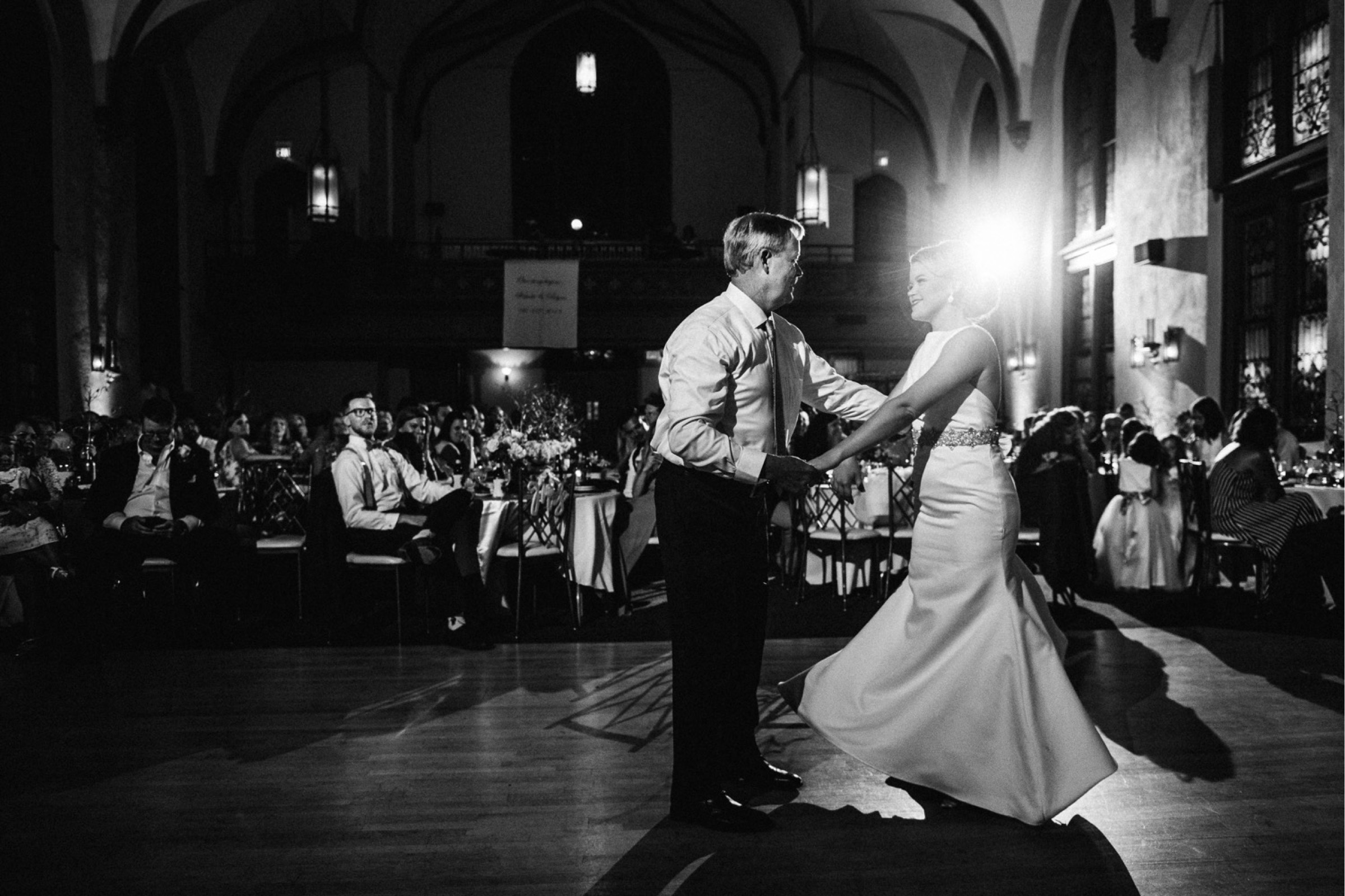 the bride dances with her father during the reception portion of the wedding day timeline
