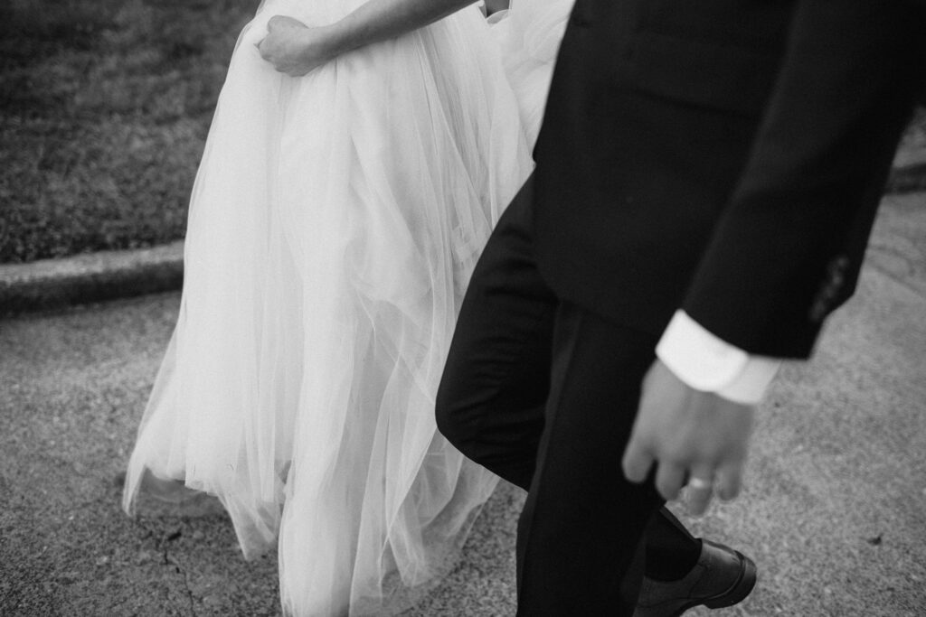 a couple walks hand in hand after their elopement wedding ceremony